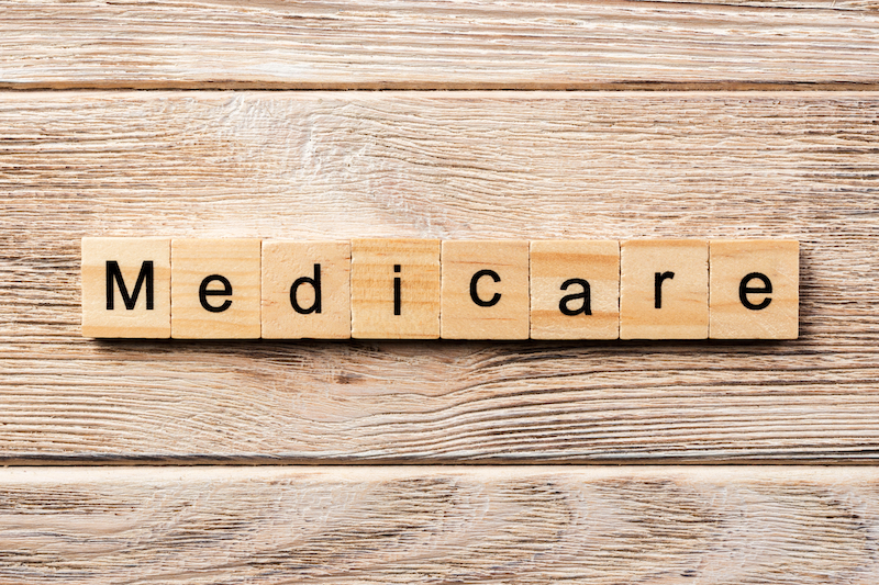 the word 'medicare' spelt out in scrabble cubes