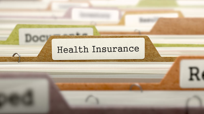 a health insurance policy in a folder