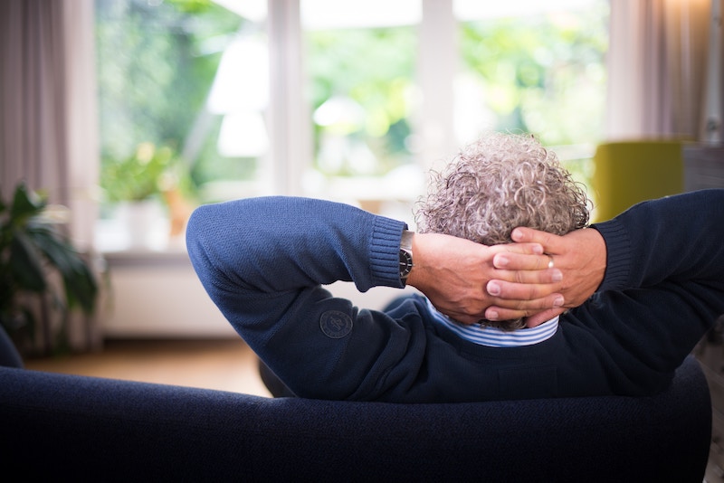 an older man on a sofa