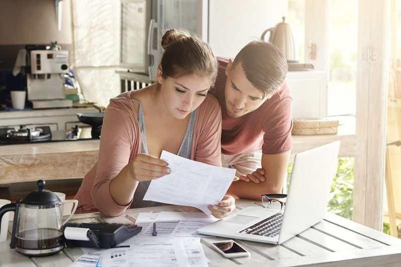 two people looking at a policy